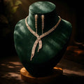 Gold-tone rhinestone X-cascade necklace with long dangling earrings
