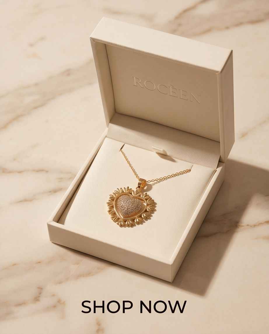 Gold heart pavé pendant on a fine chain necklace, shown in an open jewelry box