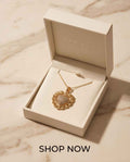 Gold heart pavé pendant on a fine chain necklace, shown in an open jewelry box