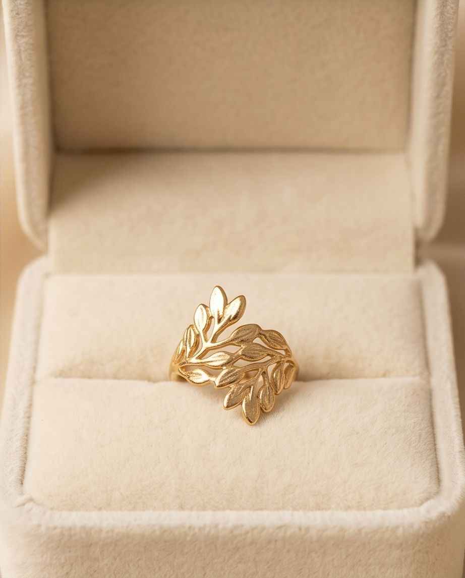 Gold-tone leaf statement ring shown in a jewelry box