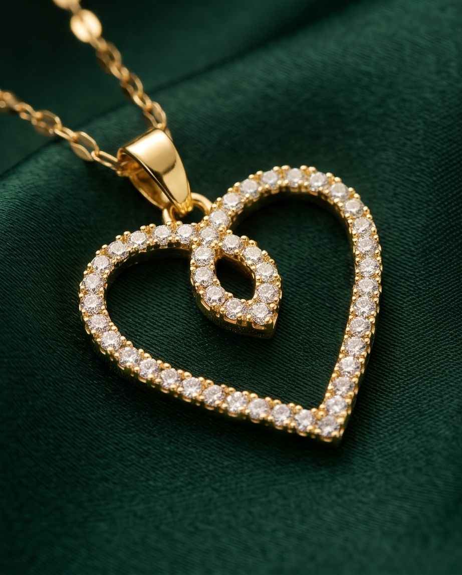 Gold heart pendant with diamond-like pavé stones on a gold chain