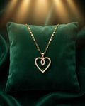 Gold heart pendant necklace with pavé sparkle on a fine chain