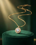 Gold halo pendant necklace with round center crystal and pavé halo on chain