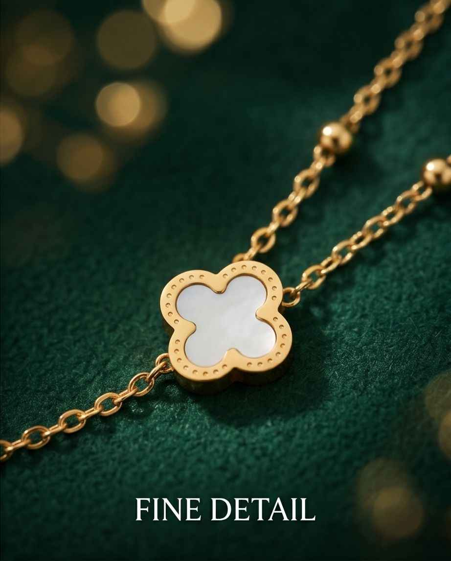 Gold clover charm necklace with mother-of-pearl center and small chain links