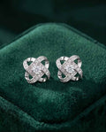 Sterling silver knot stud earrings with pavé sparkle and center round stone, pair