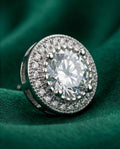 Éclat Royale 925 round stud earrings with pavé halo and clear center stone