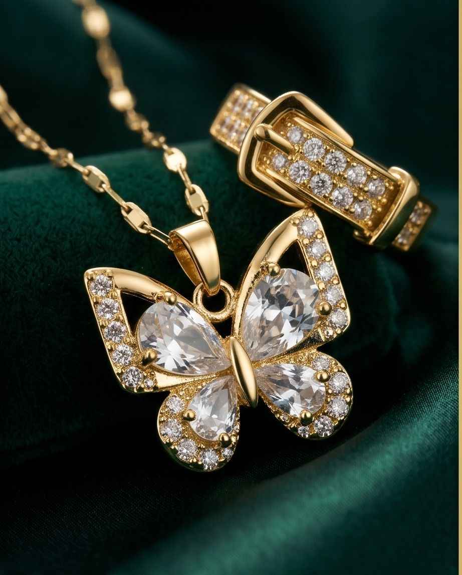 Gold-tone butterfly pendant necklace with pavé stones and matching ring