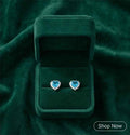 Blue heart halo stud earrings, silver-tone setting with clear stone halo