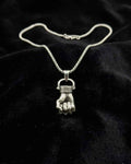 Silver-tone pendant necklace with clasp chain and hand-shaped charm