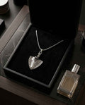 Shield pendant necklace with silver-tone chain and engraved shield charm