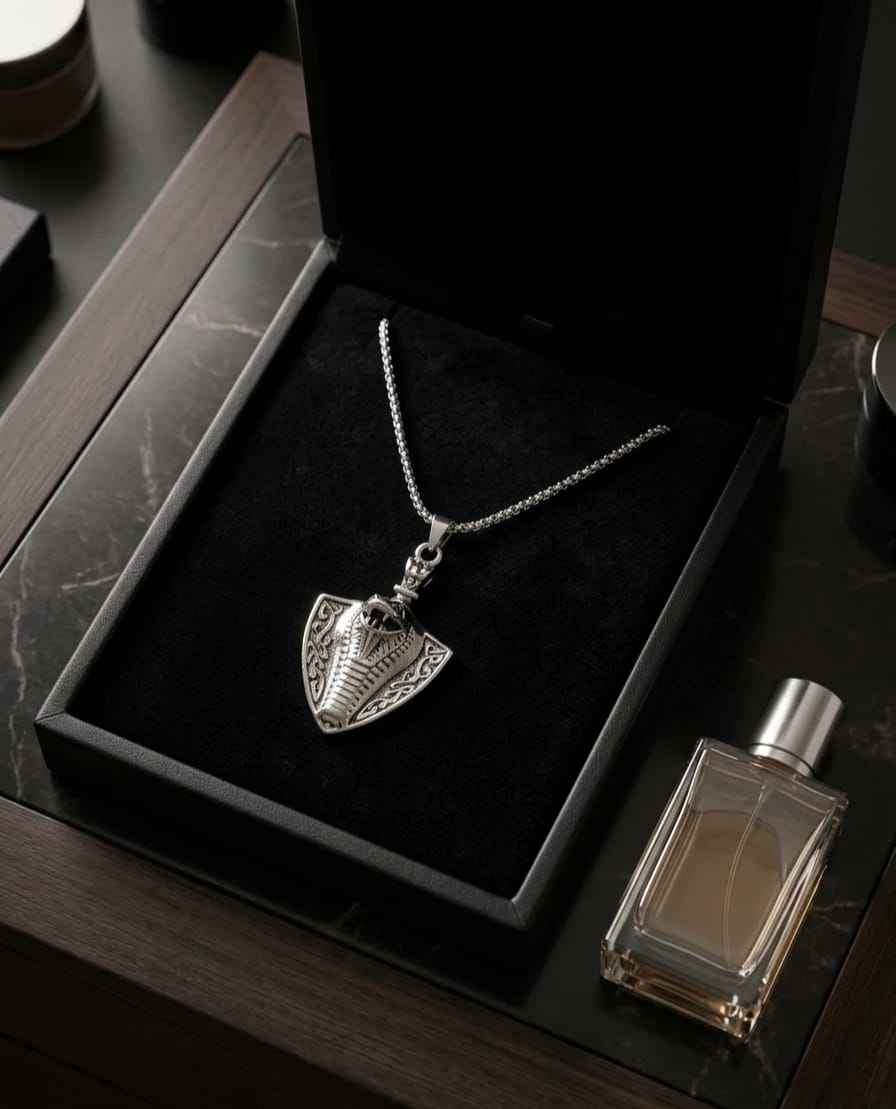 Shield pendant necklace with silver-tone chain and engraved shield charm