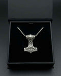 Silver Mjölnir hammer pendant necklace with linked chain and ornate cross-style engravings