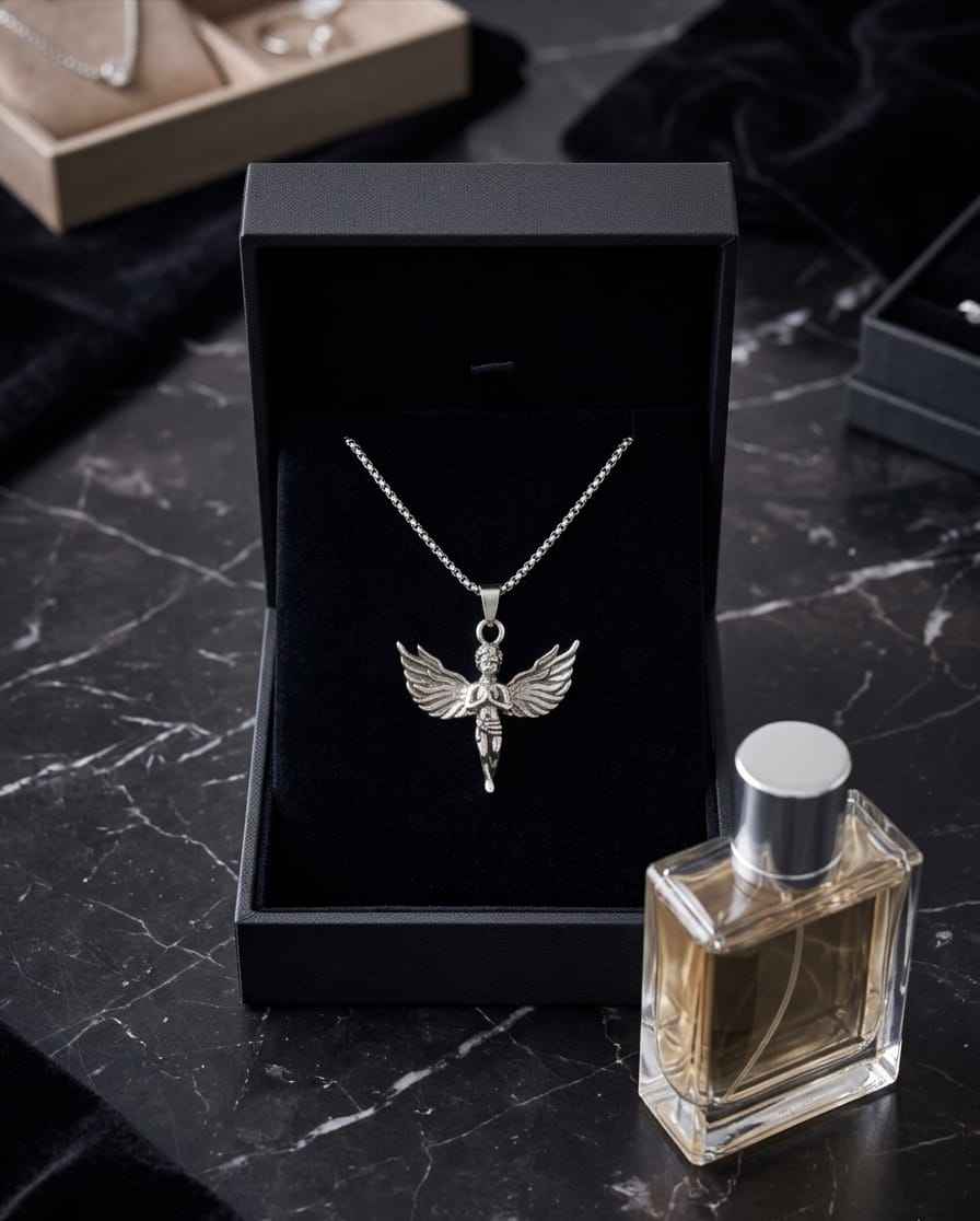 Silver angel pendant necklace with wings and cherub charm centered on a chain