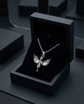 Silver angel pendant necklace with wings and cherub charm on a silver chain