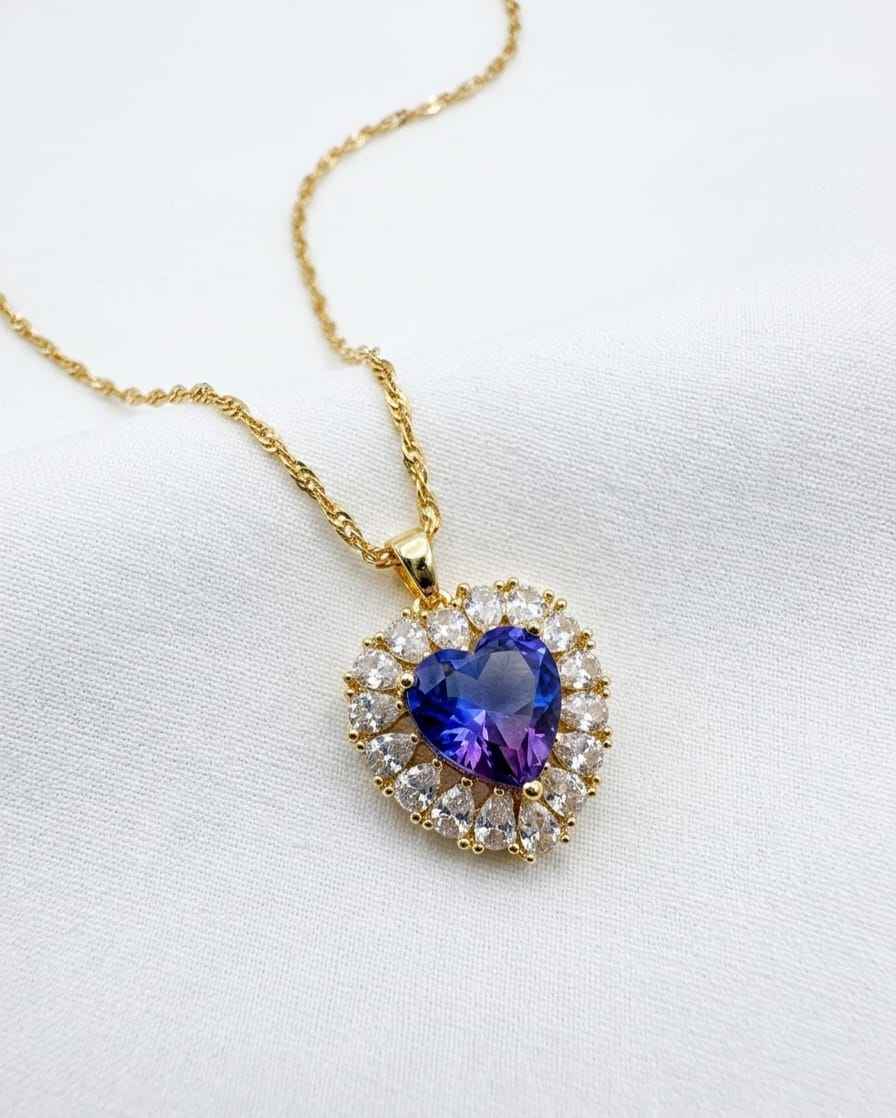 Gold-tone heart pendant necklace with blue sapphire-style crystal and clear accents