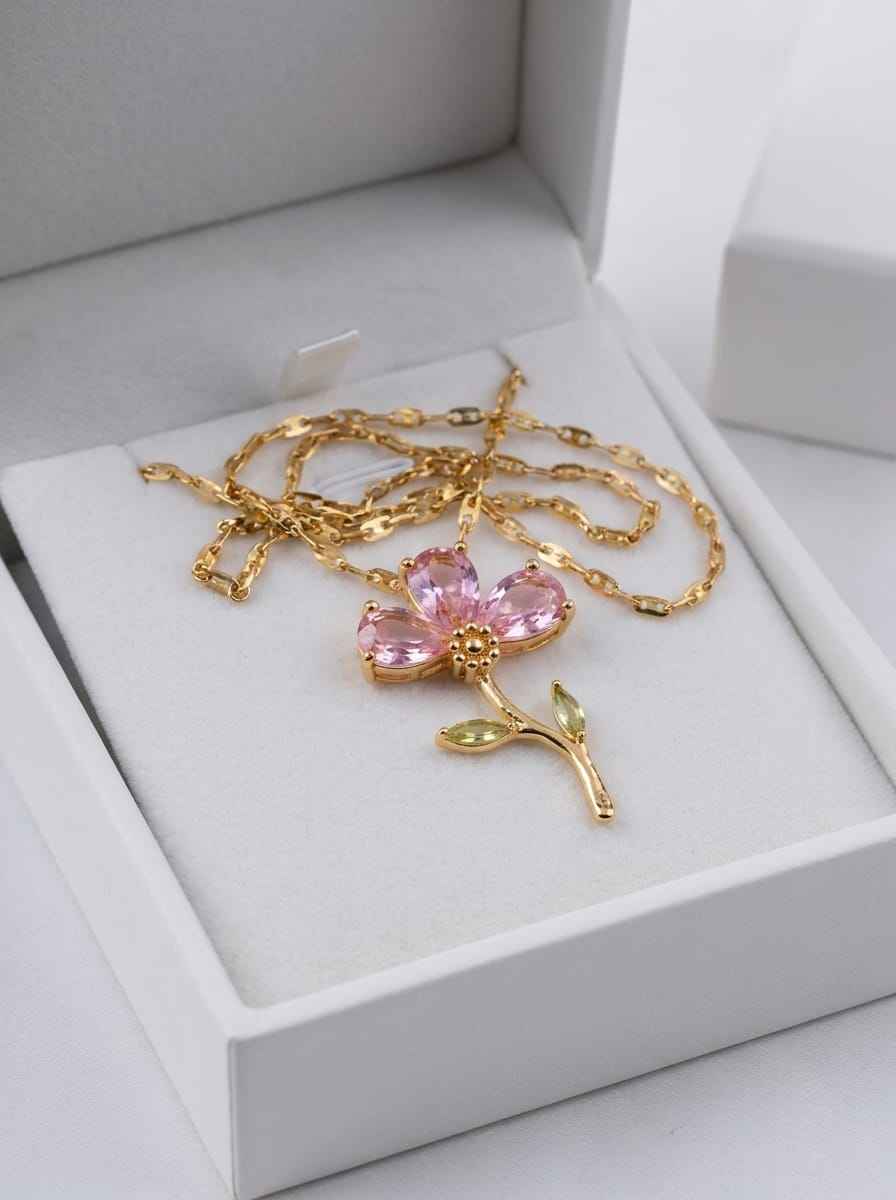Gold tone crystal flower pendant necklace in gift box, pink petals and green leaves
