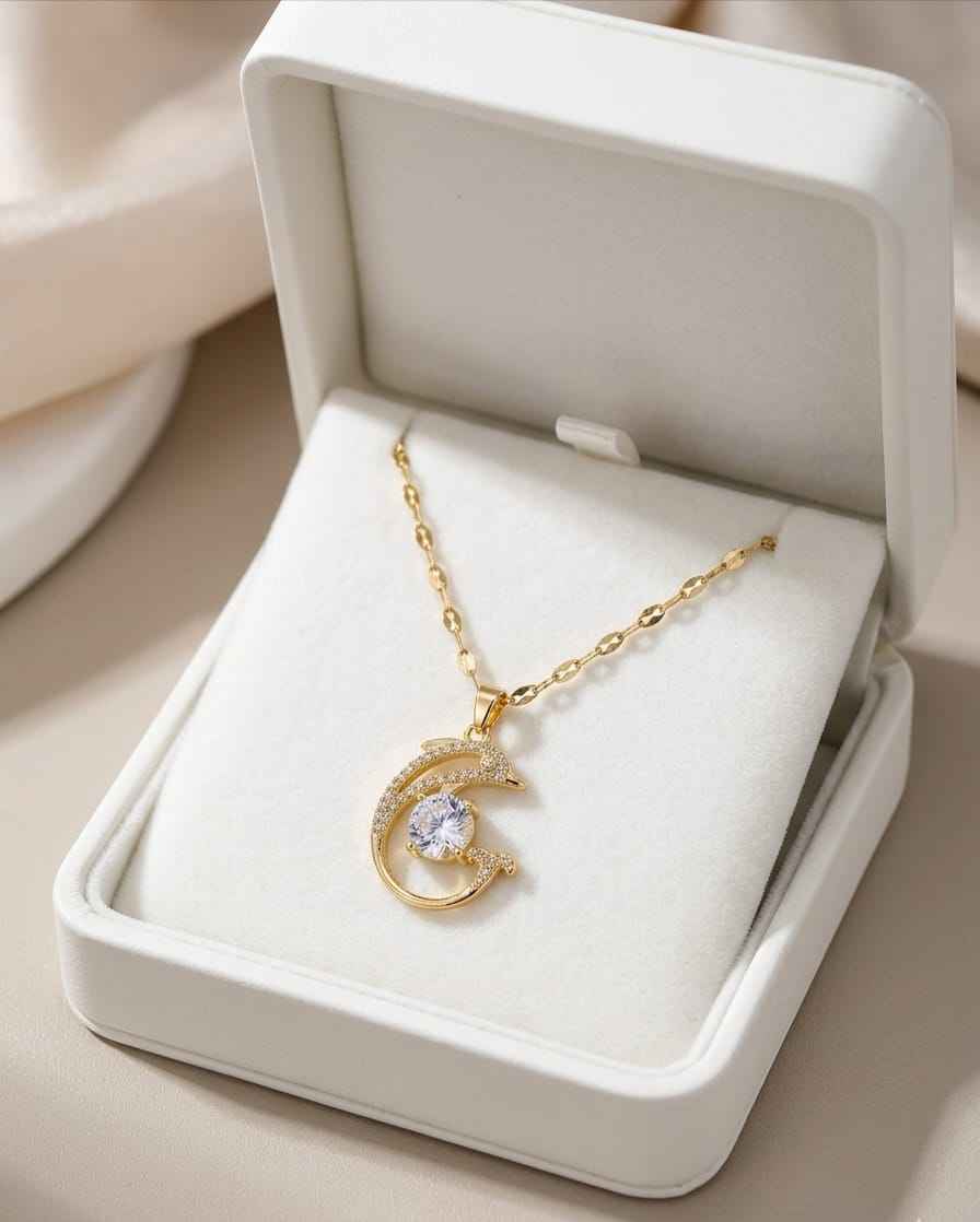 Gold crescent pendant necklace with round clear crystal and small pavé stones
