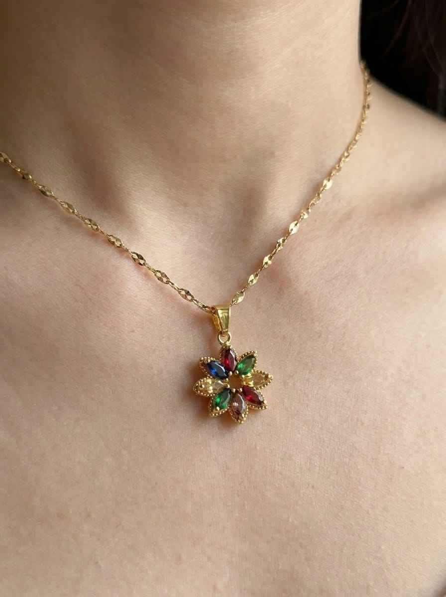 Gold crystal flower pendant necklace with multicolor gemstone petals on a chain