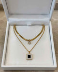 Duo gold-tone necklace with round crystal charm and black square pendant in gift box