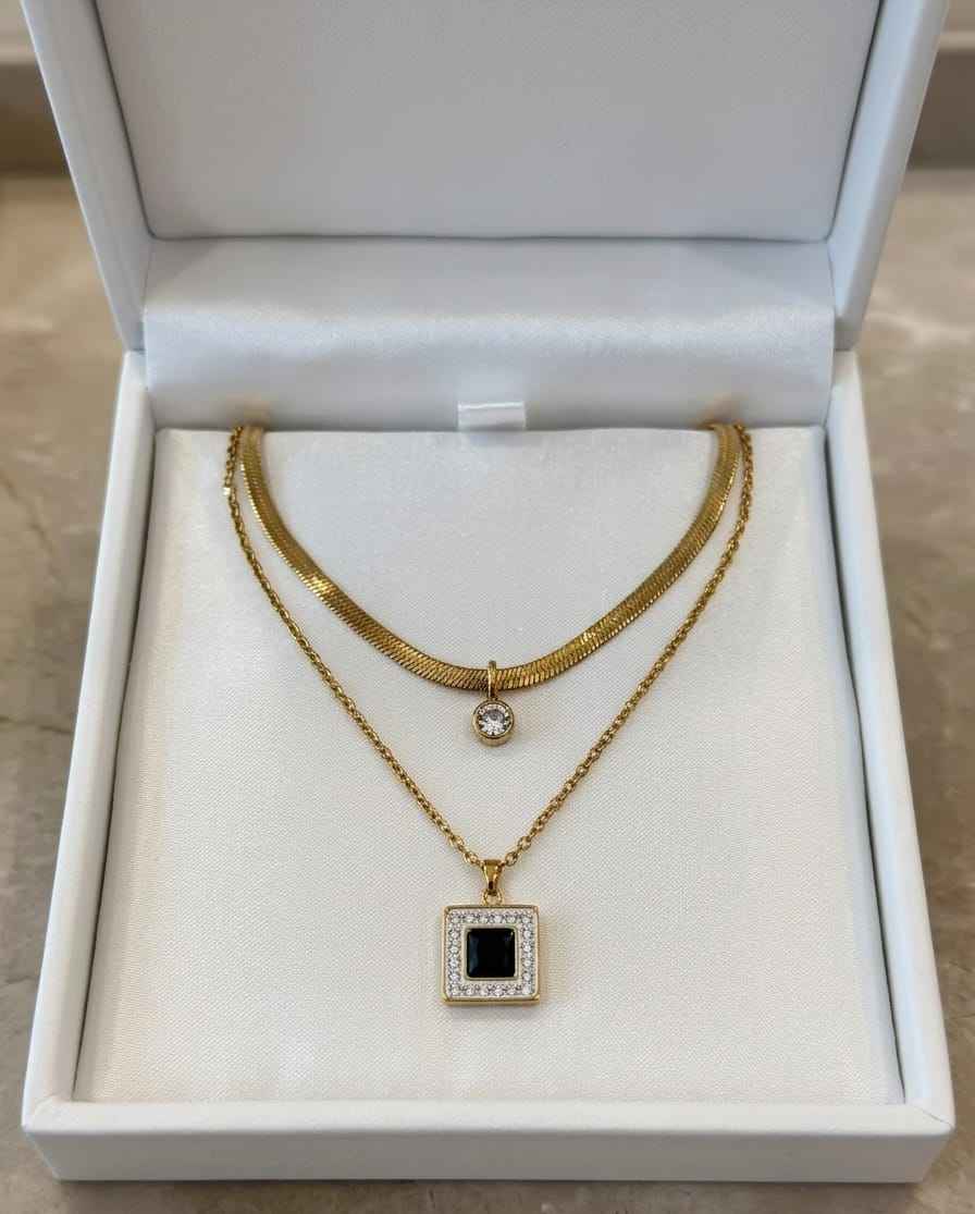 Duo gold-tone necklace with round crystal charm and black square pendant in gift box