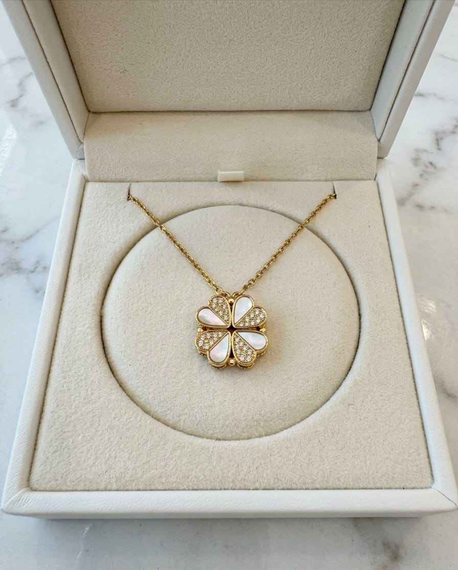 Gold-tone flower pendant necklace with pearl-like white enamel drops and crystals