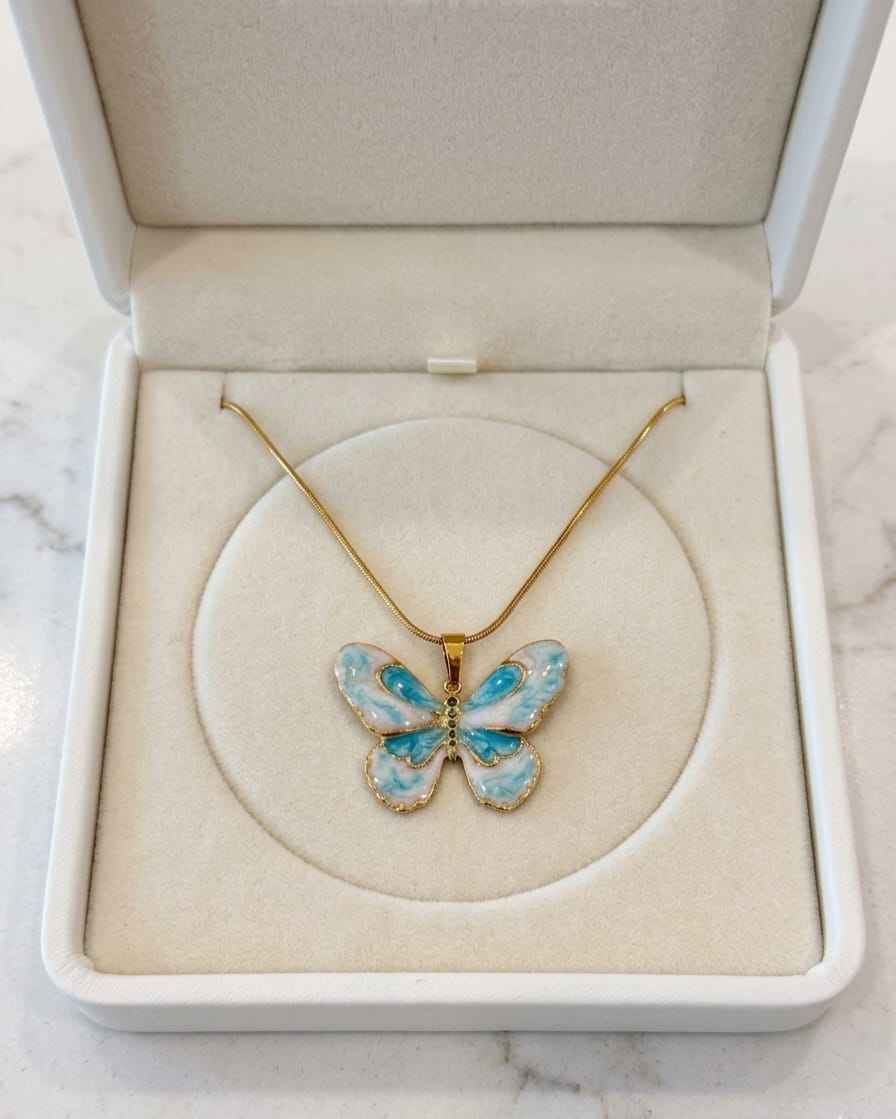 Gold-tone necklace with blue enamel butterfly pendant