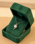 925 sterling silver solitaire pendant necklace with round clear stone, on green velvet box