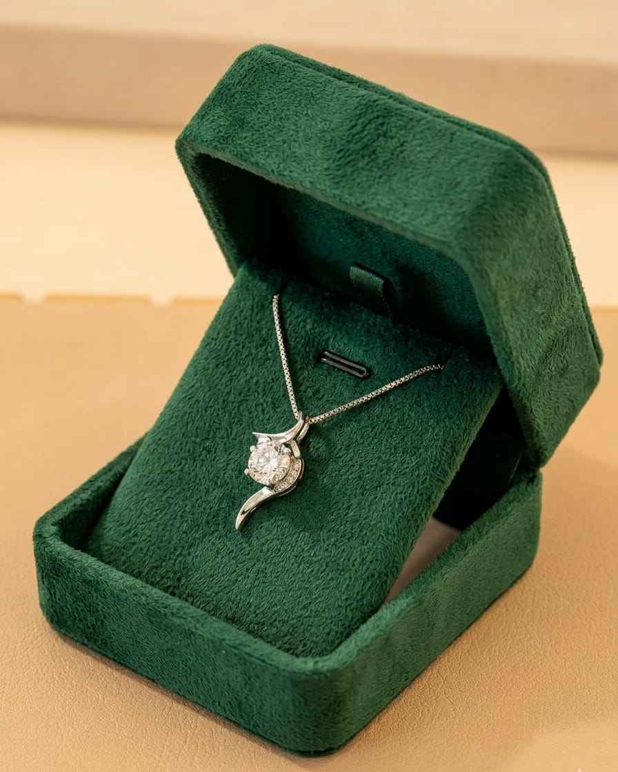 925 sterling silver solitaire pendant necklace with round clear stone, on green velvet box