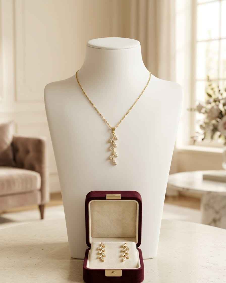 Gold fleur-drop necklace set with matching earrings
