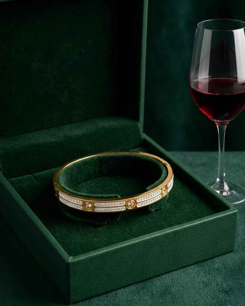 Gold-tone link bangle with pavé stripes and round center stones