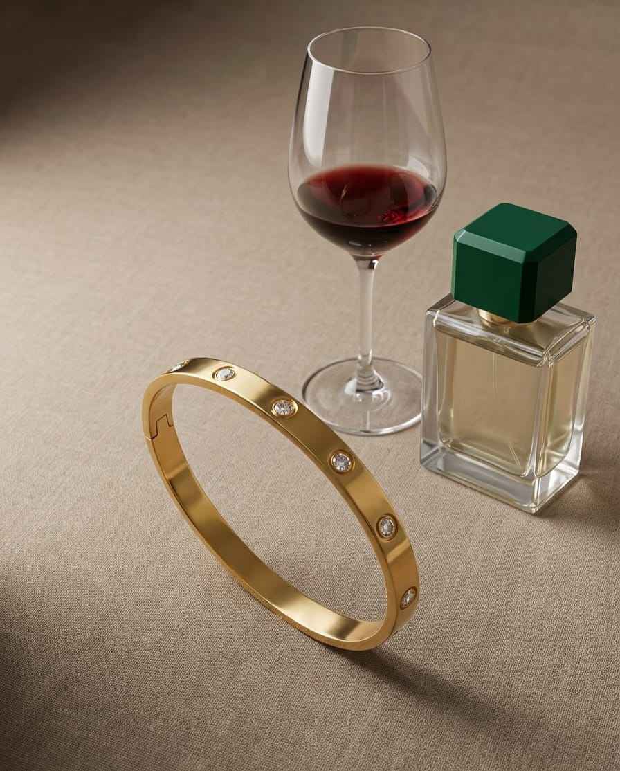 Gold bezel diamond bangle with round bezel-set stones on the front