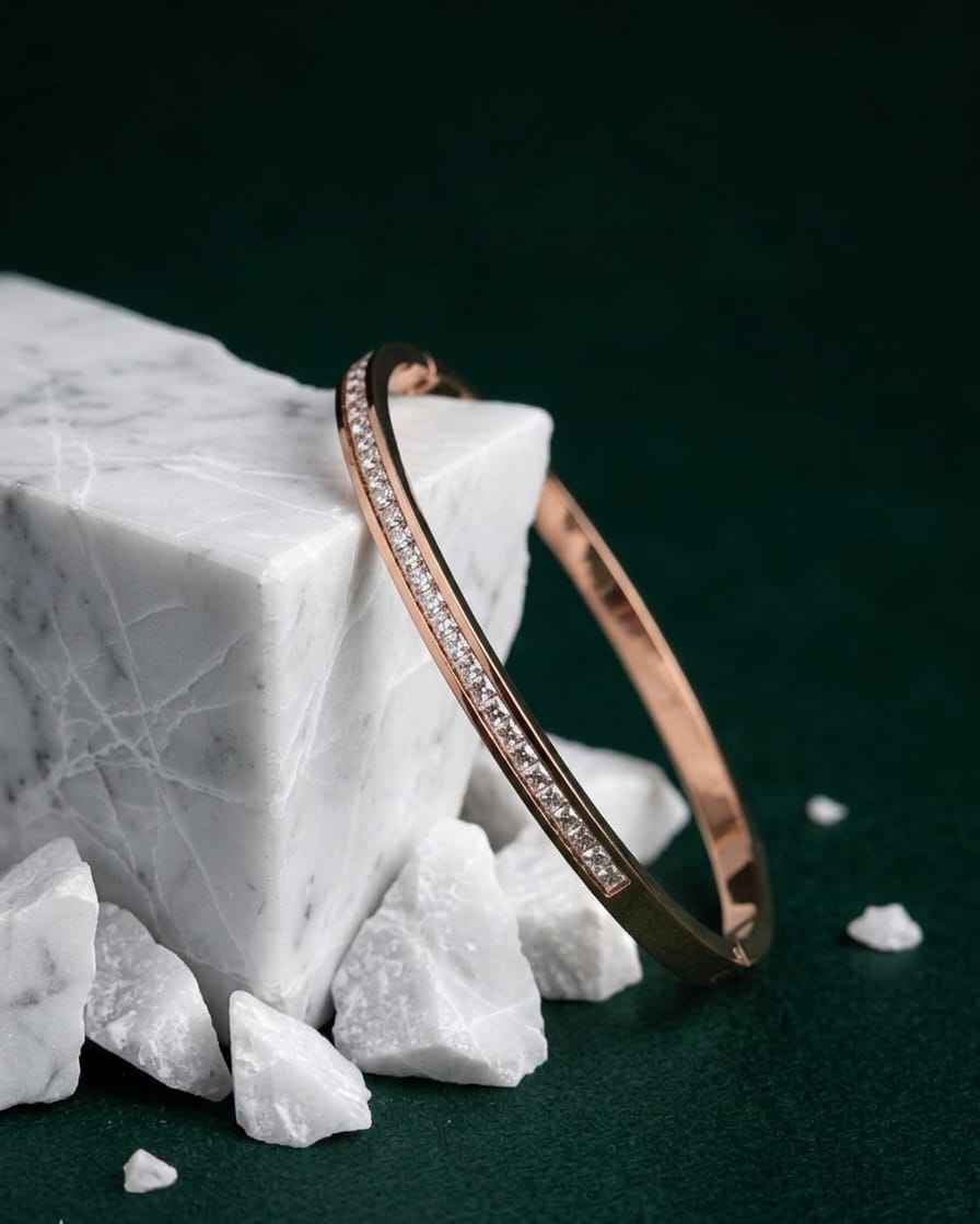 Rose gold pavé bangle with a single row of clear stones