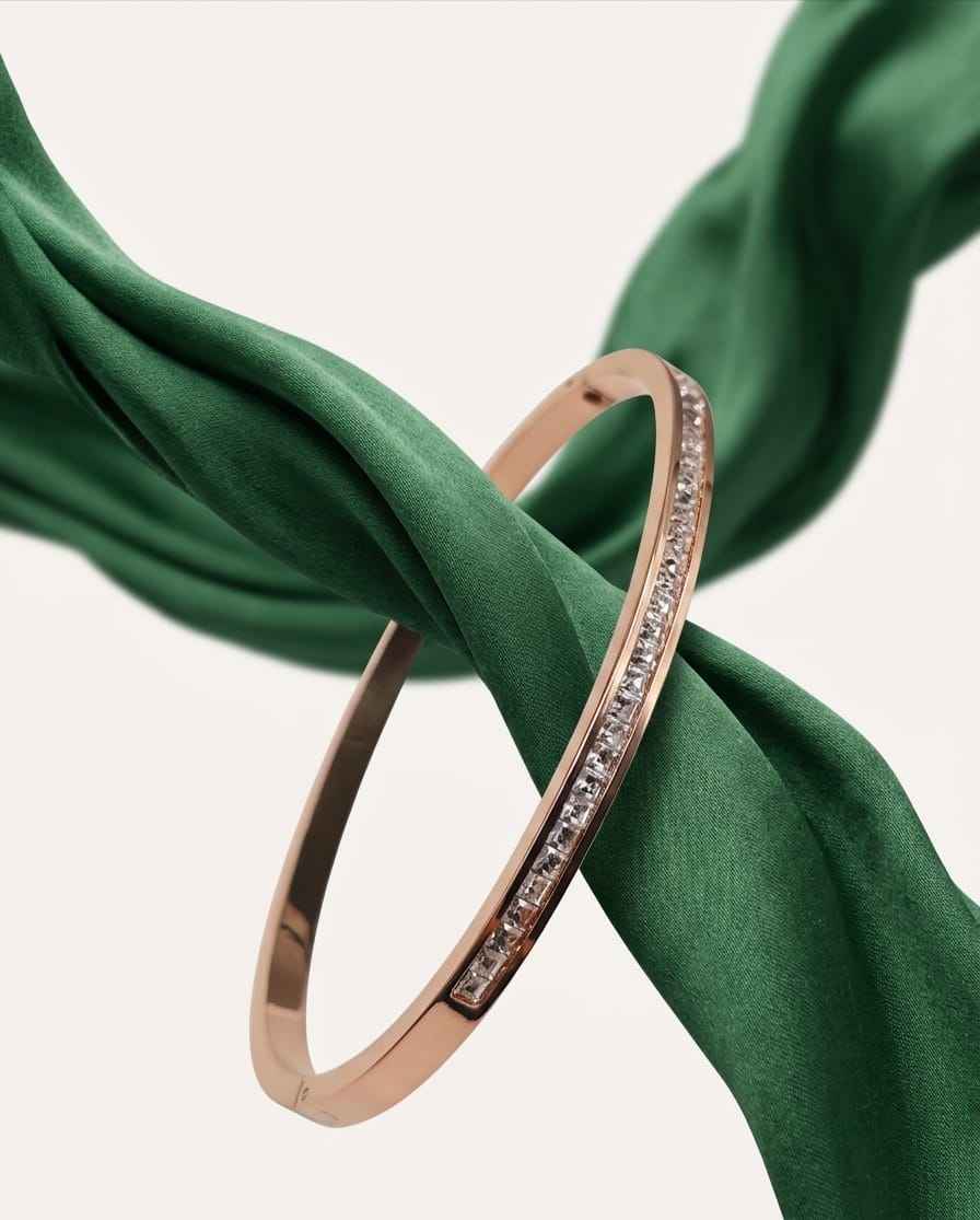 Rose gold pavé bangle with a single row of clear stones