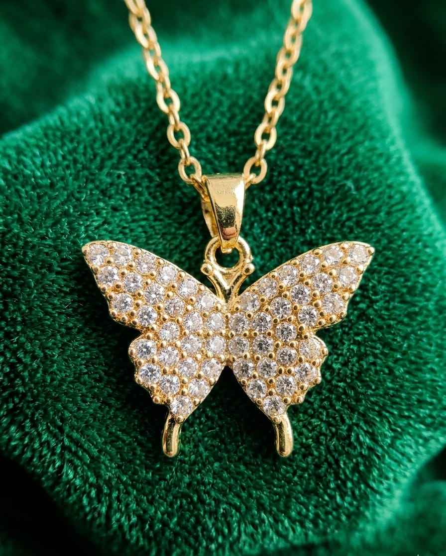 Gold pavé butterfly pendant necklace with link chain and bail loop