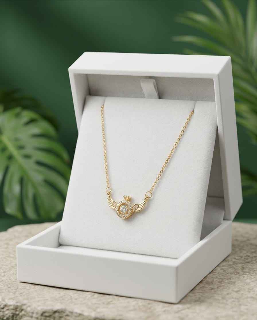Gold winged halo pendant necklace with round crystal center, displayed in jewelry box