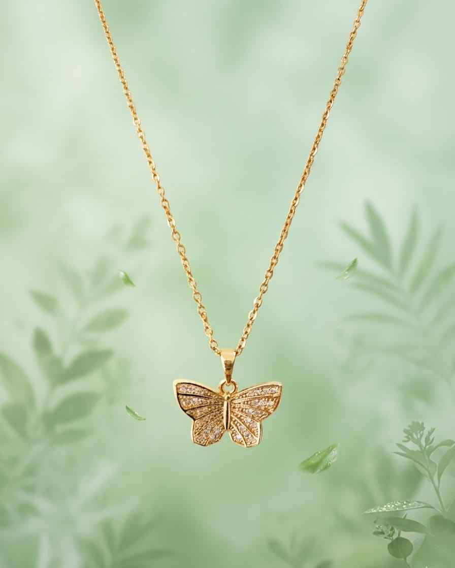 Gold butterfly charm necklace with pavé sparkle and long link chain