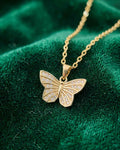 Gold butterfly pendant necklace with glitter stones and link chain