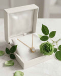 Gold solitaire necklace with round crystal pendant on a thin chain