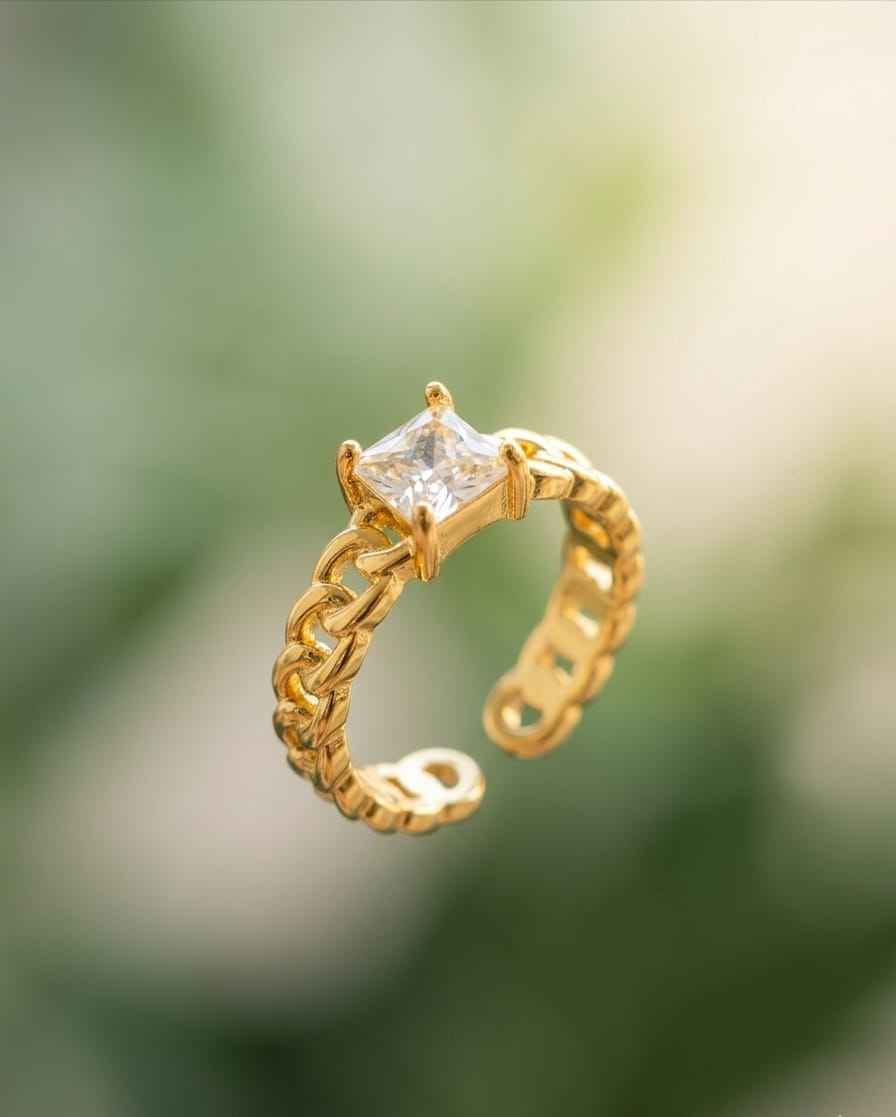 Gold-tone chain solitaire ring with square clear center stone, side view