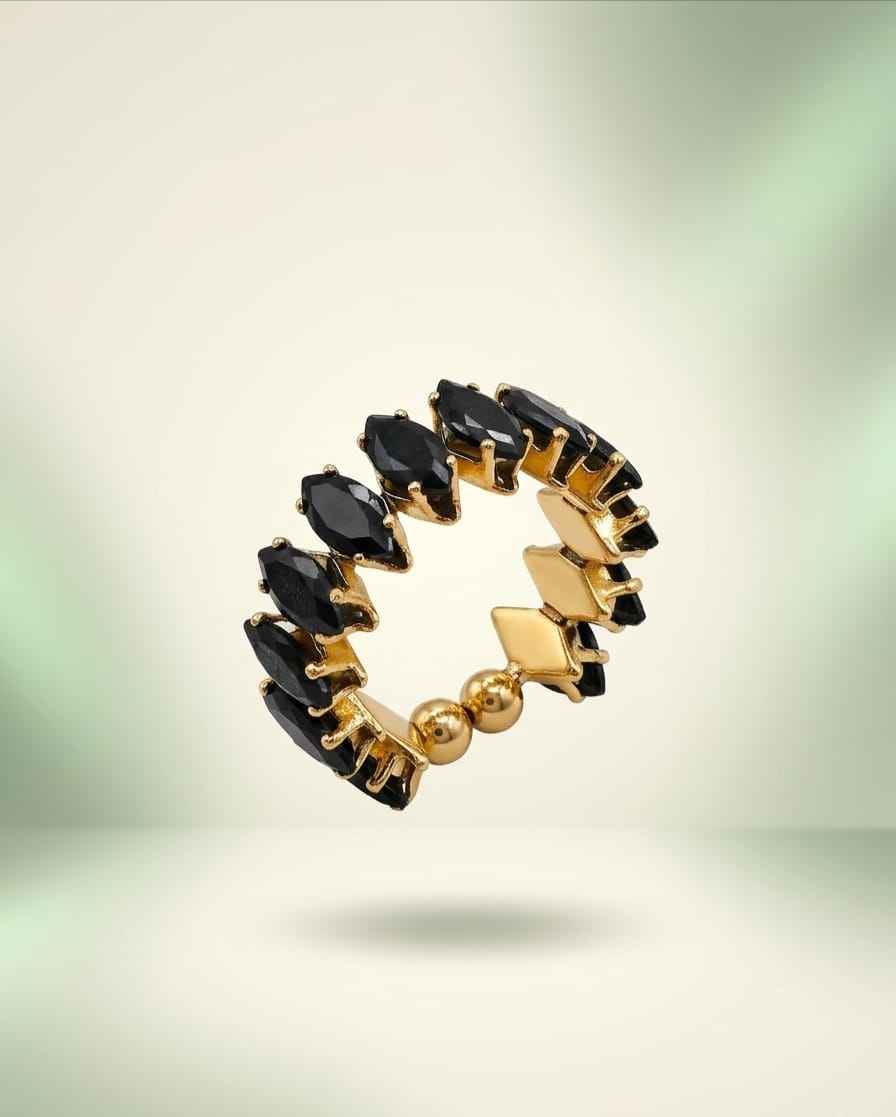 Open marquise link ring with dark gemstones and gold-tone settings