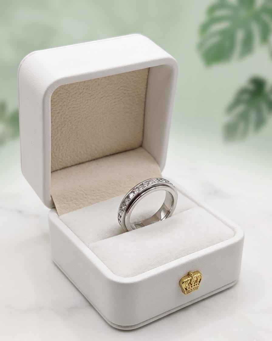 Eternal pavé band ring in a white jewelry box, stone-lined silver band