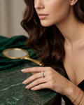 Lumière open marquise pavé ring on hand with gold-tone stones