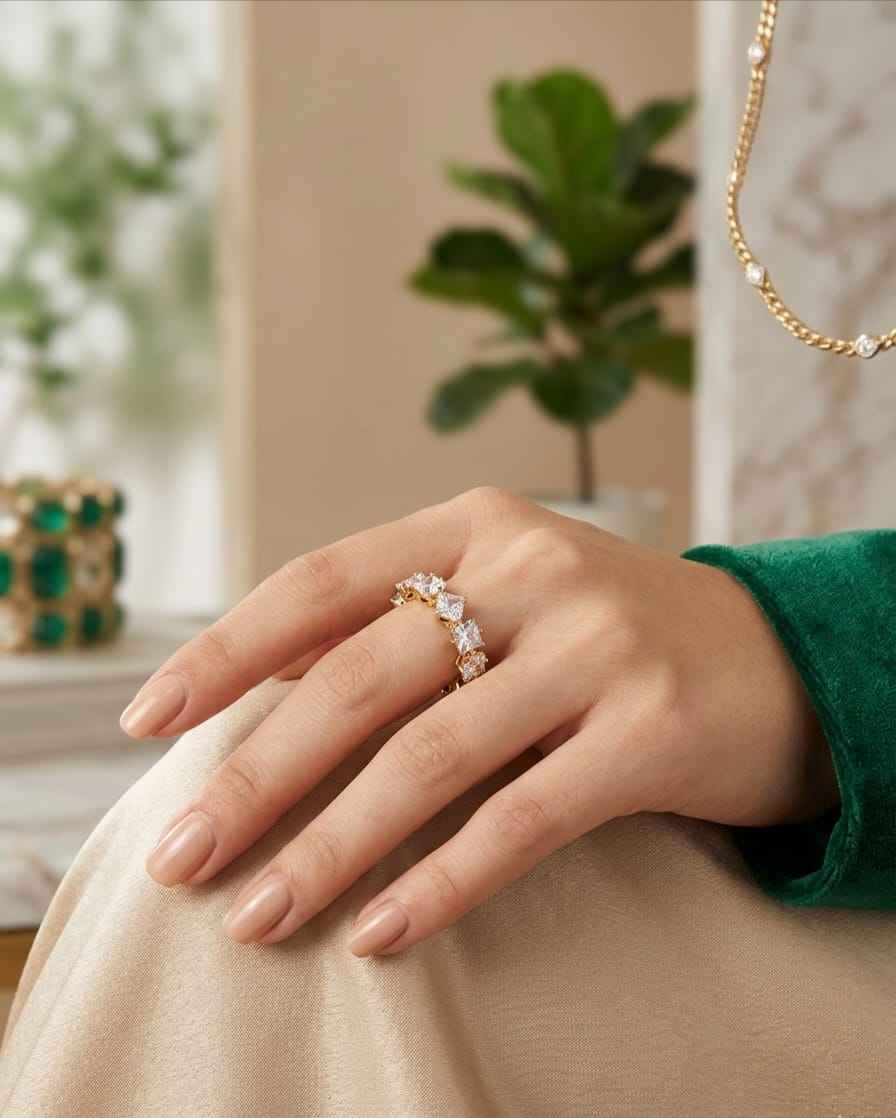 Gold-tone crystal ring with square clear stones in a curved band