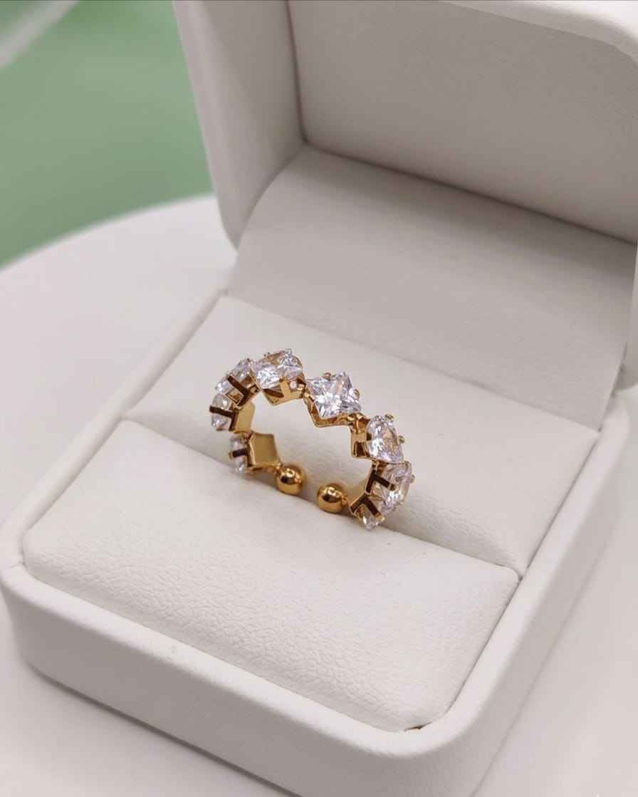 Gold-tone crystal ring with square clear stones in a sparkling open circle