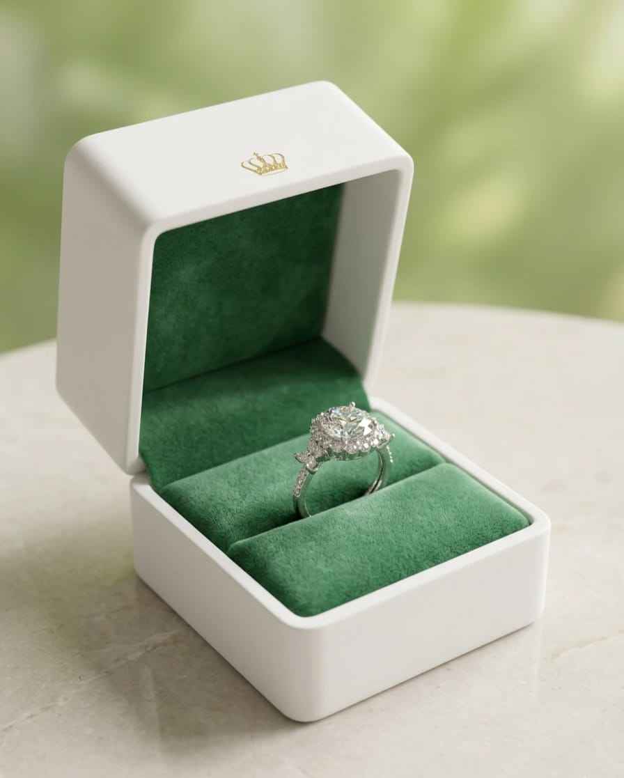 Oval halo ring in gift box, green velvet insert and ring shown