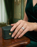 Triple band ring with silver-tone metal and clear stones, worn on hand