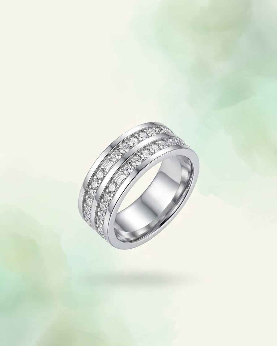 Silver-tone triple band ring with rows of clear stones, angled view