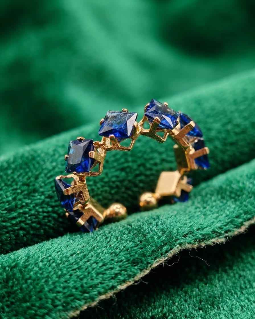 Gold open ring with blue square stone pavé and prong settings
