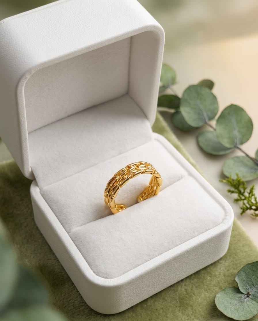 Roceen golden chain-weave ring in gold tone with braided texture.