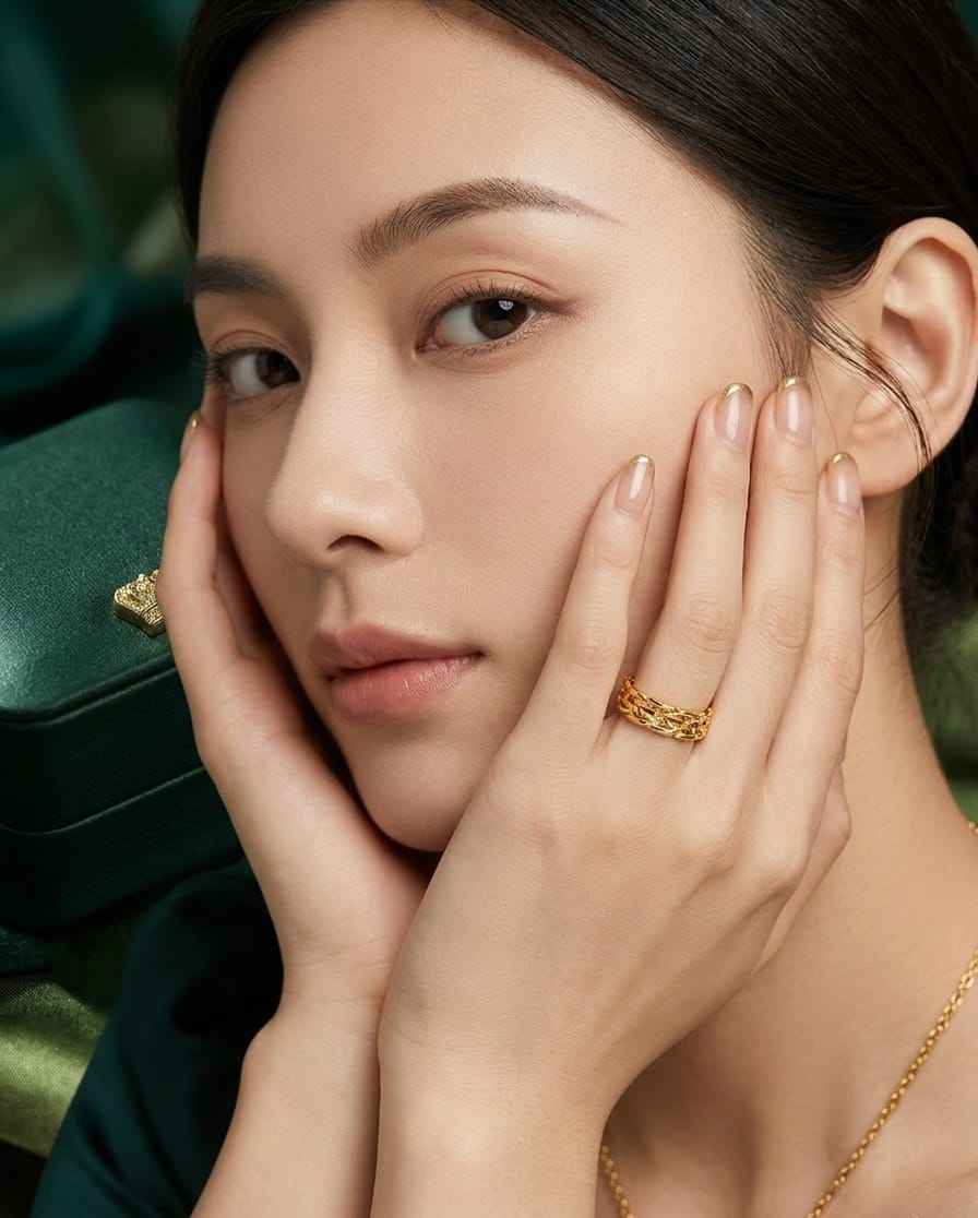 Roceen golden chain-weave ring with textured braided links.